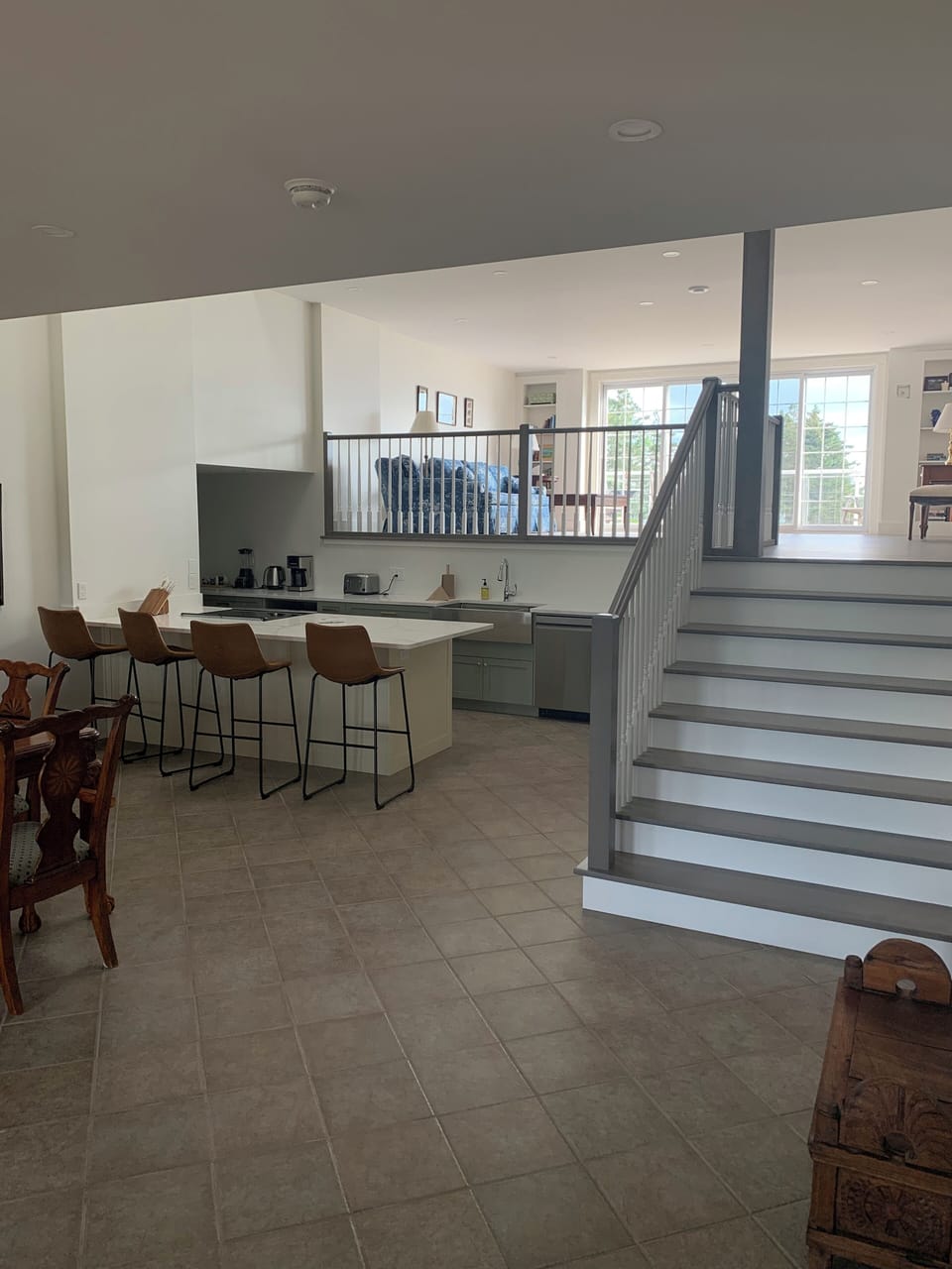 stairs to the mezzanine living room and large balcony