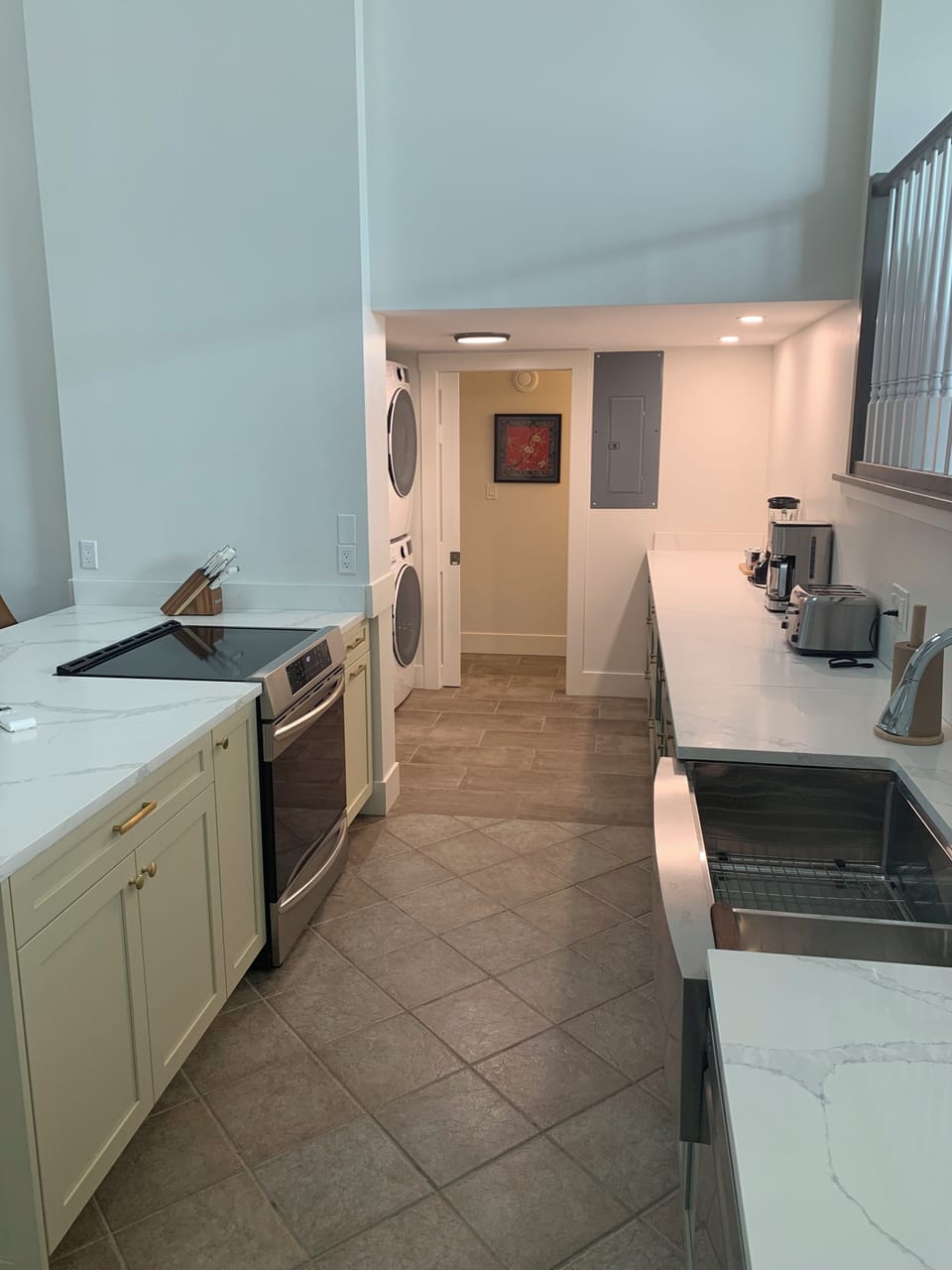 kitchen, laundry, and half bathroom