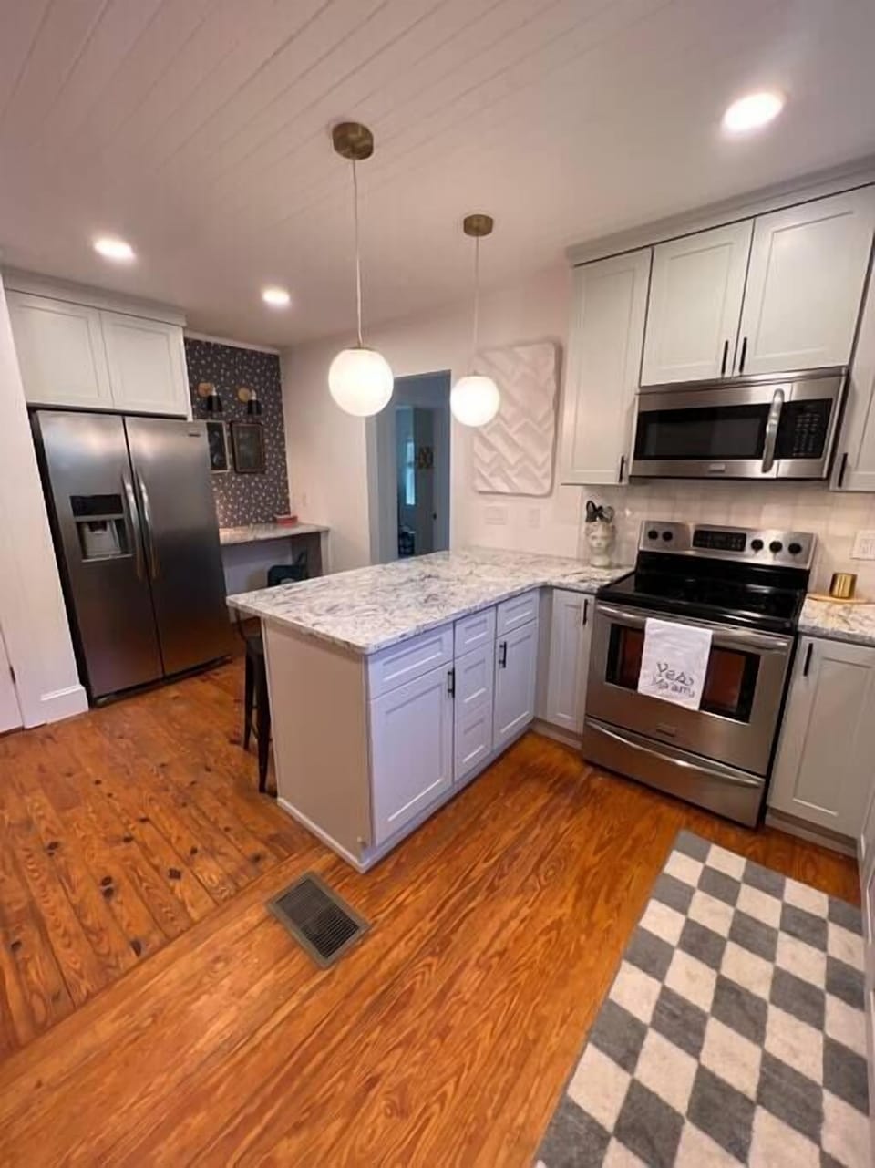 Kitchen, coffee maker, bar seating, pots, pans, large pantry, work station. 