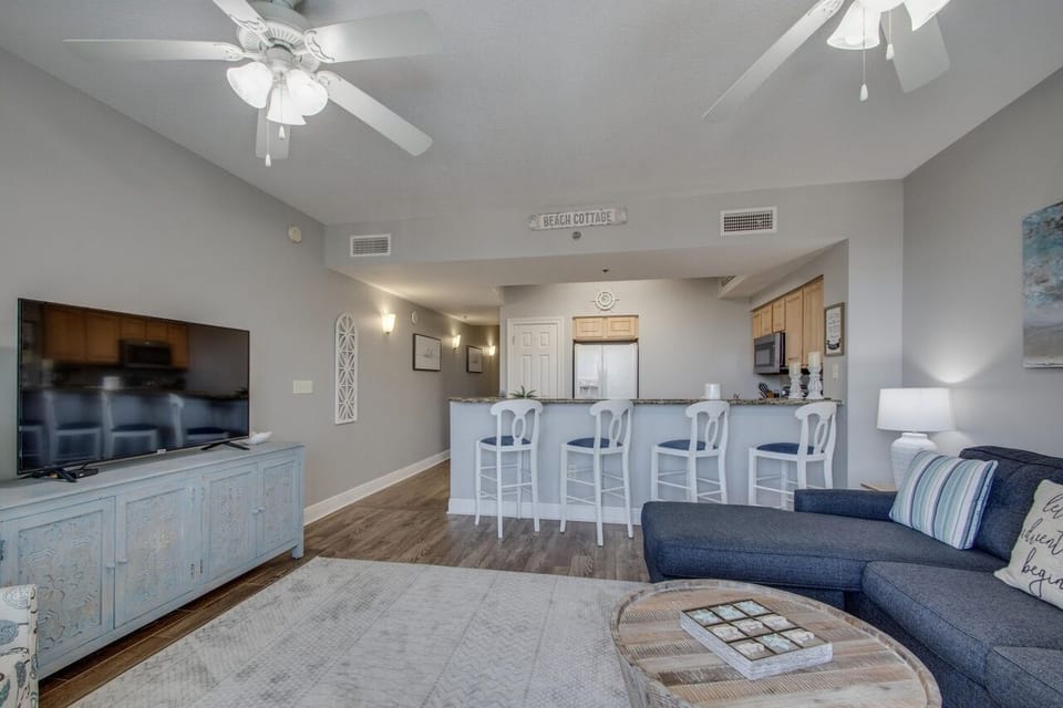 The living room and kitchen share a bright, spacious area