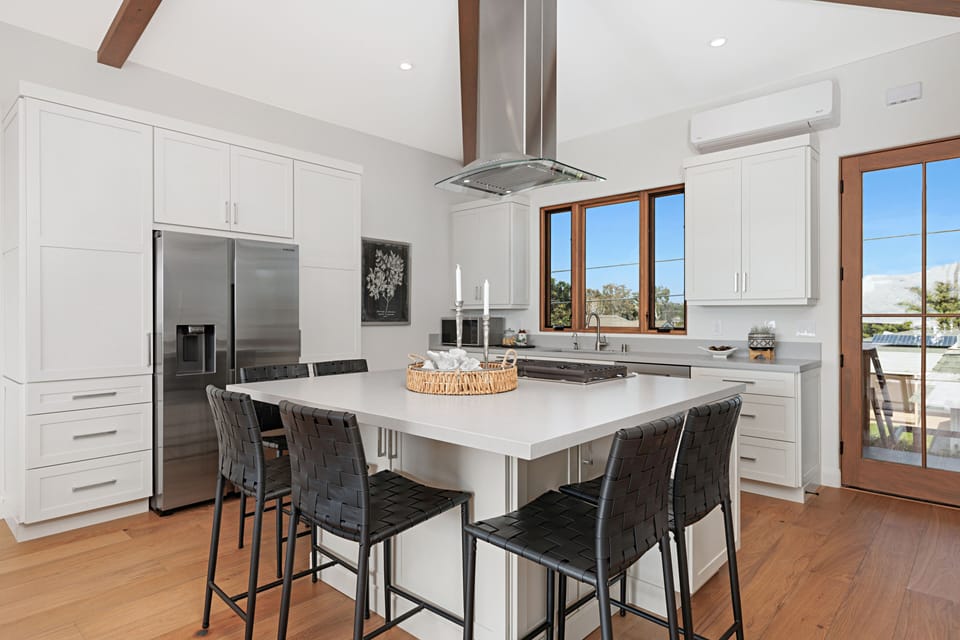 Kitchen is fully equipped with four seats around kitchen island