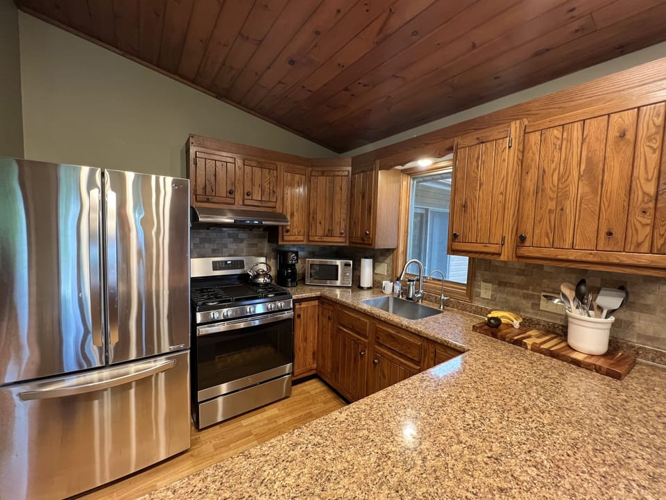 Full kitchen with cookware, grill gear, a griddle stove, oils and spices.