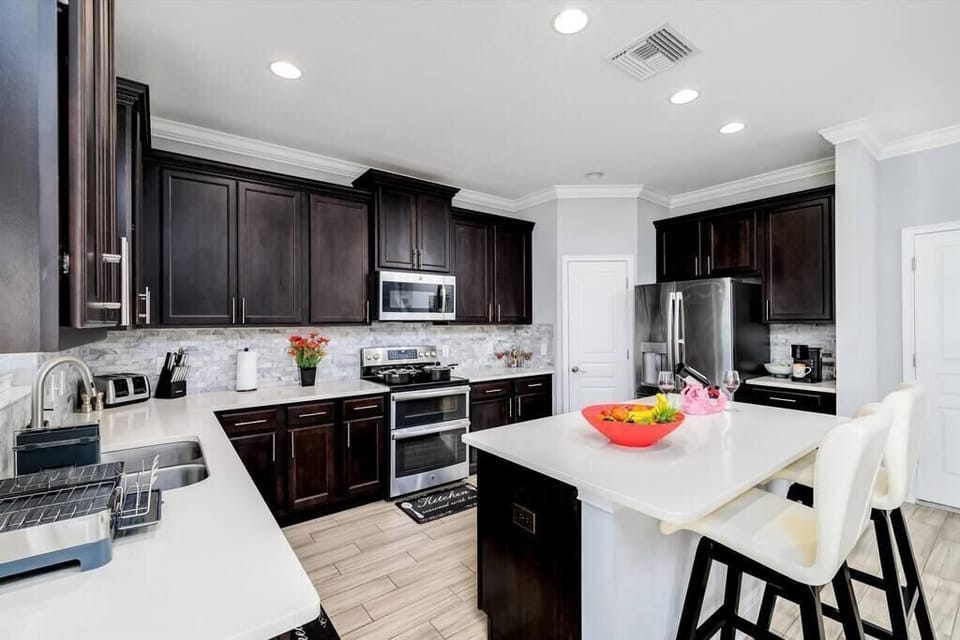 Chef kitchen features all kitchen cookware(pots, pans, utensils, cups, glasses, knives, etc.), double oven ceramic top stove, double french door and double freezer refrigerator.