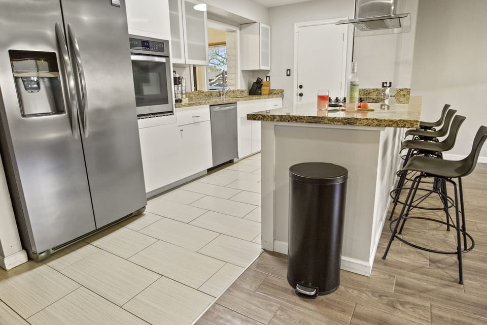 kitchen with a full island and stools