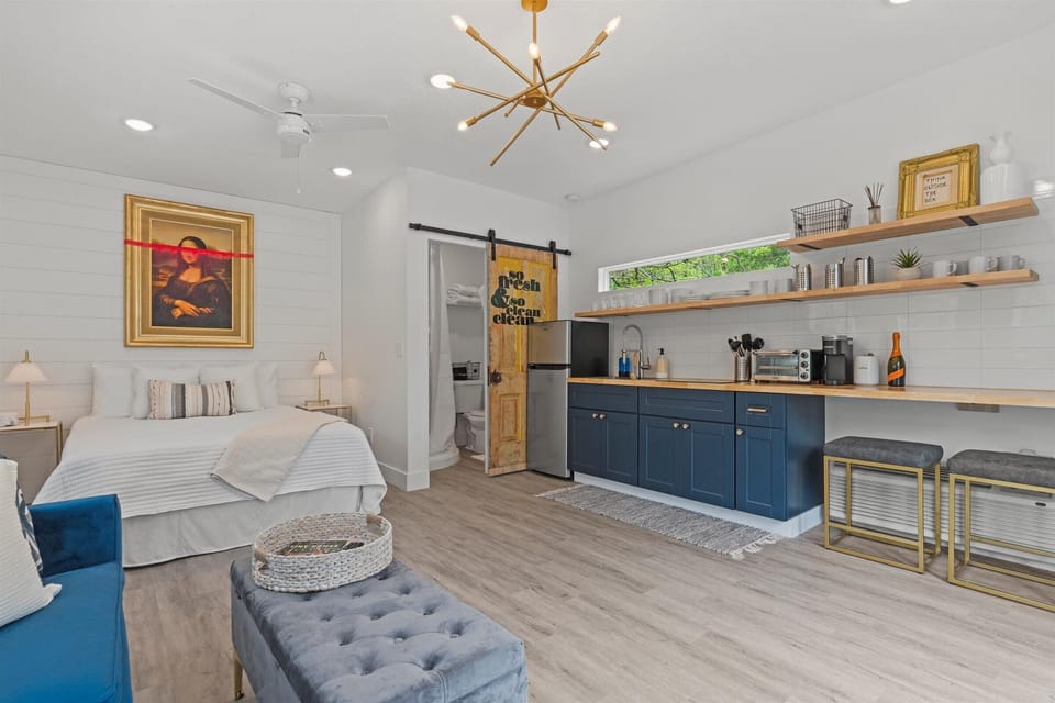 320 square foot Tiny House. Kitchenette, living room with sleeper sofa, bathroom, and queen bed.