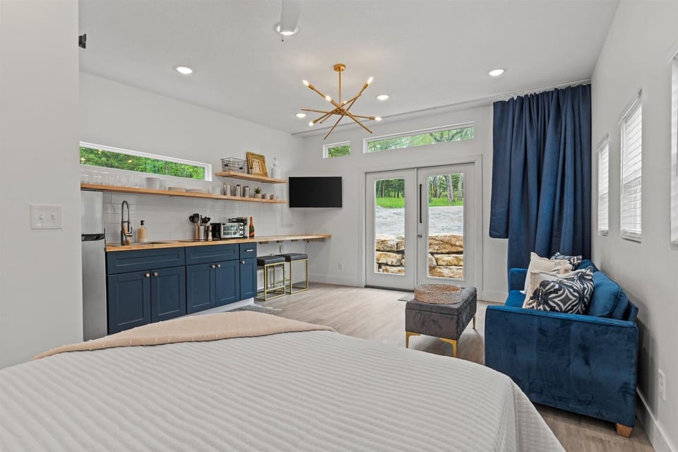 320 square foot Tiny House. Kitchenette, living room with sleeper sofa, bathroom, and queen bed.