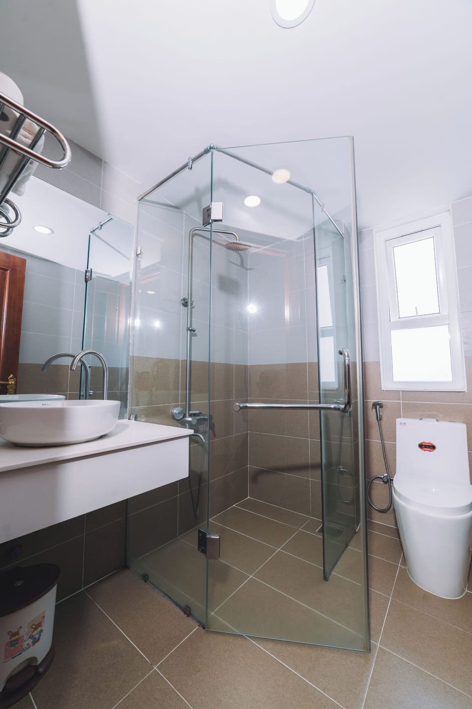 Designer toiletries, hair dryer, slippers, towels
