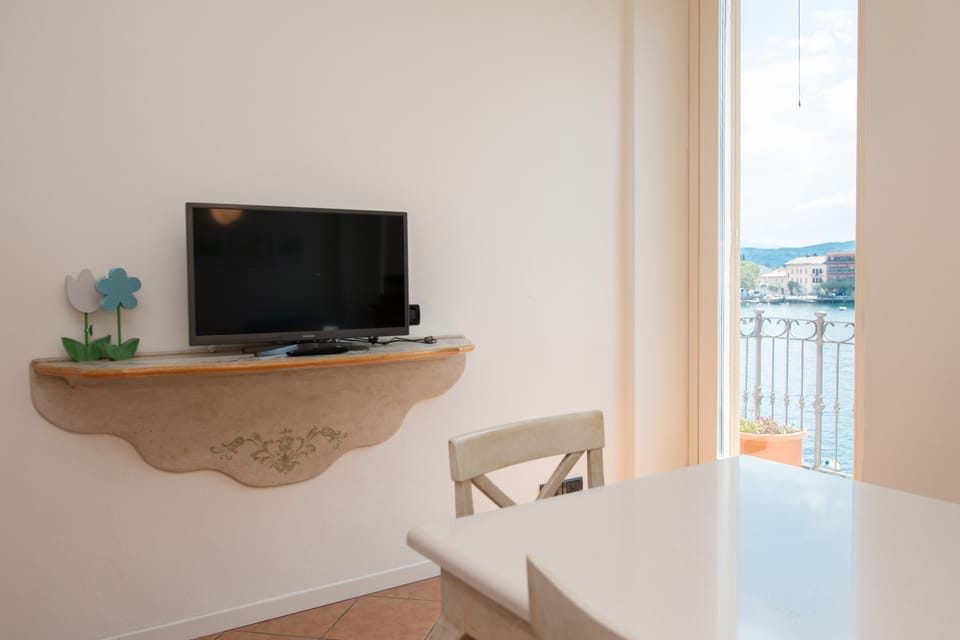 Romantic Apartment | Living area | 30-inch TV with digital channels