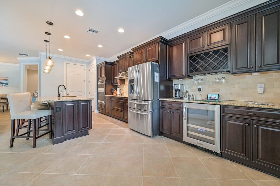 Villa Paradise at The Preserve - Fully equipped kitchen with island and bar area with beverage center