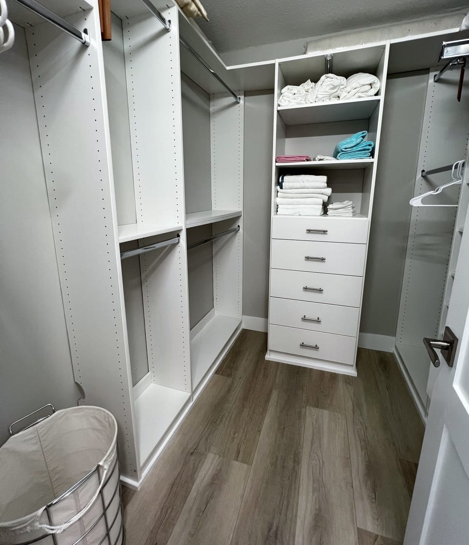 Spacious walk in closet in the master suite. - Spacious walk in closet in the master suite.