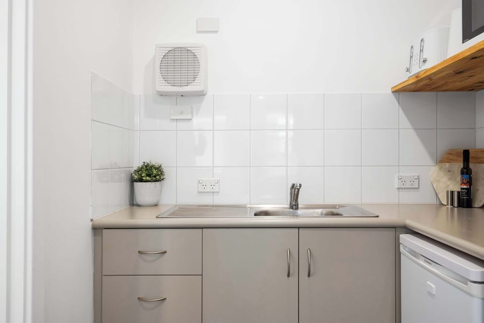 Kitchenette, featuring mini fridge/freezer, kettle, coffee pod machine,toaster, mircrowave and hot plate