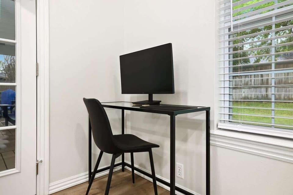 Our desk area is complete with a desk chair, spare monitor and provided cables.