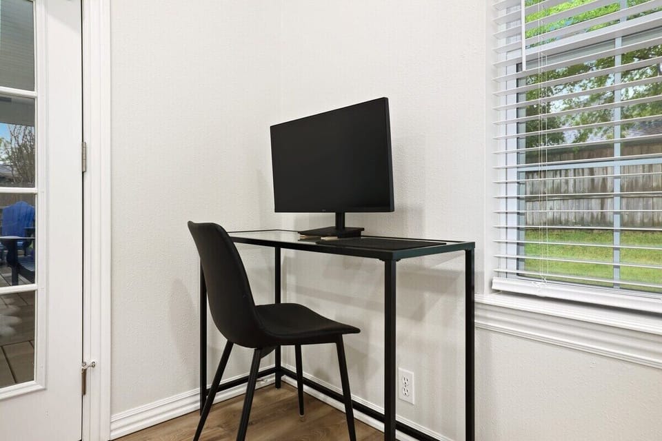 Our desk area is complete with a desk chair, spare monitor and provided cables.