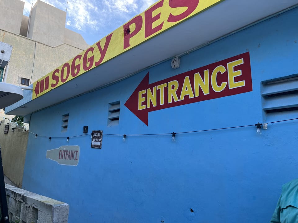 At the drive way, follow the sign to enter the Soggy Peso. 