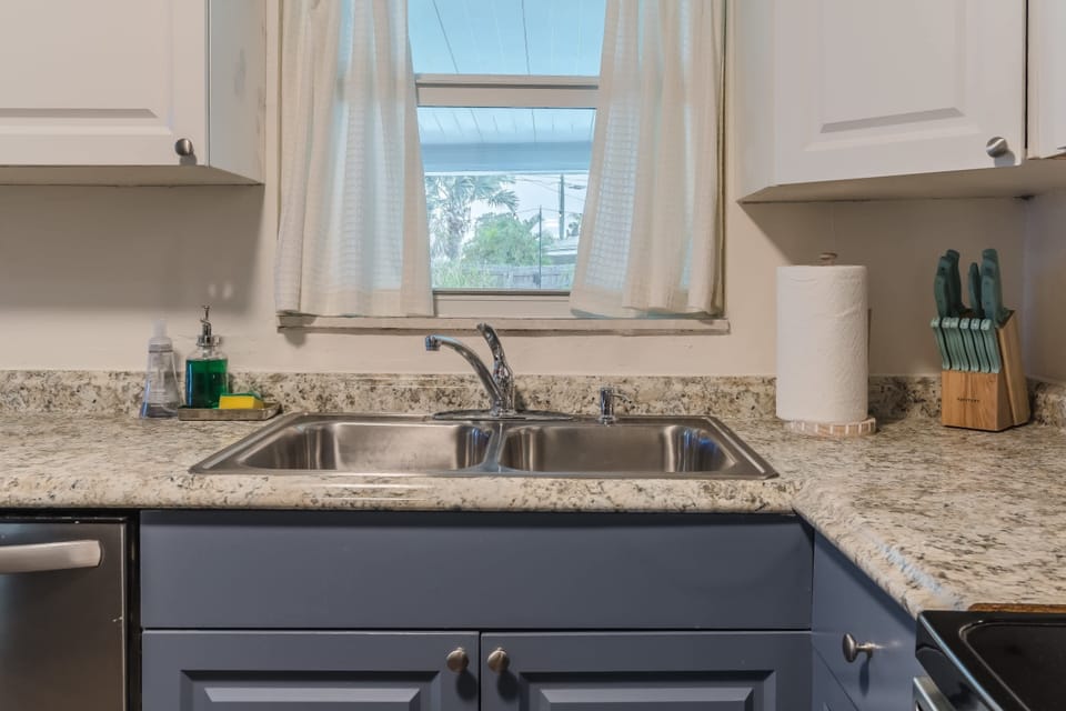 Modern kitchen w/ sleek counters and clean lines for easy meal prep.