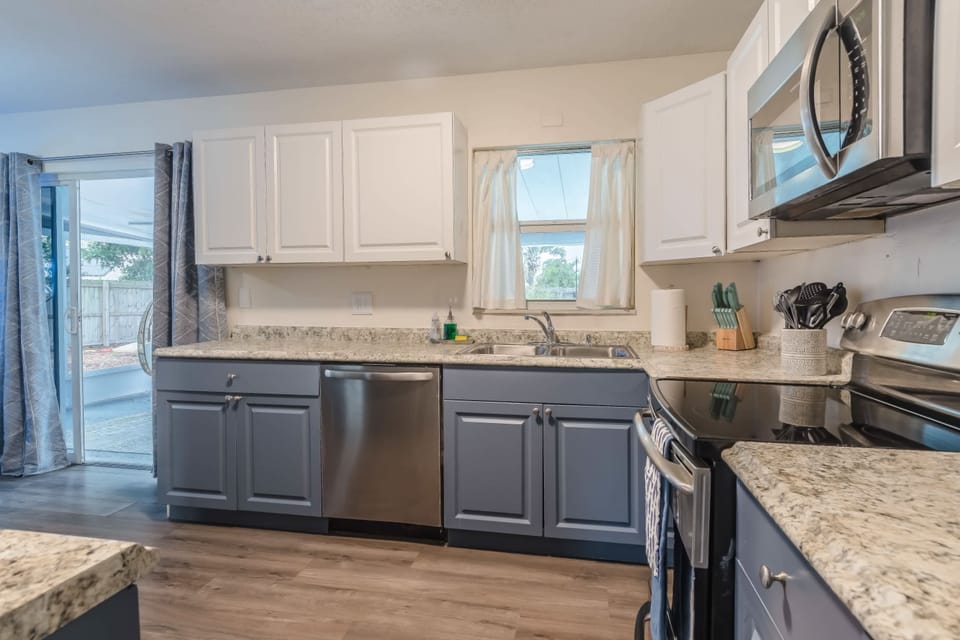 Functional kitchen layout w/ ample workspace and natural light.