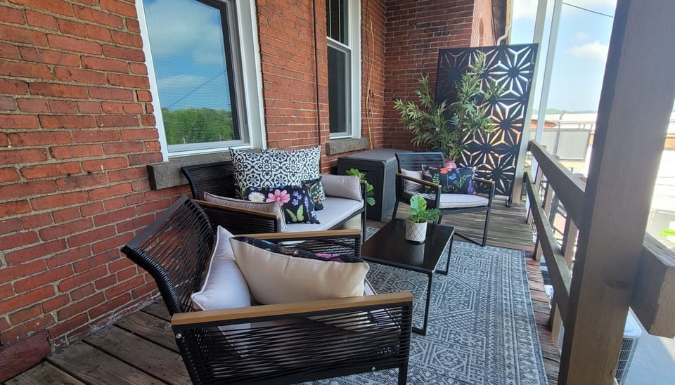 Relax on our shabby-chic back deck — twinkle lights, comfy seating for 4, and a front-row seat to the local fireworks show.