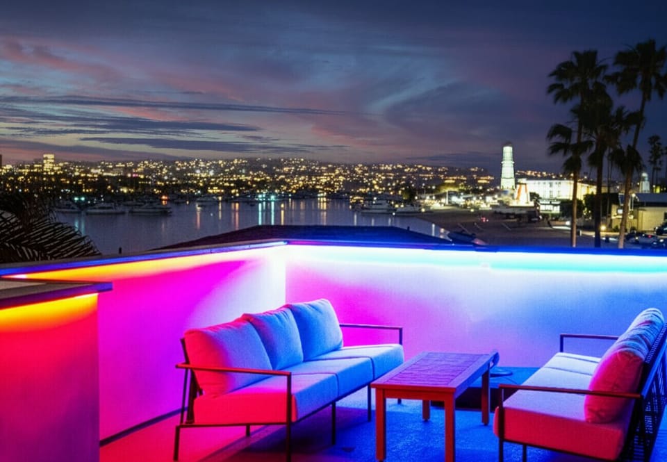 Private harbor-view rooftop with custom mood lighting—the ultimate spot for sunset cocktails.