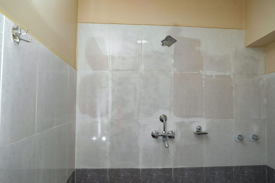Shower, rainfall showerhead, towels, soap