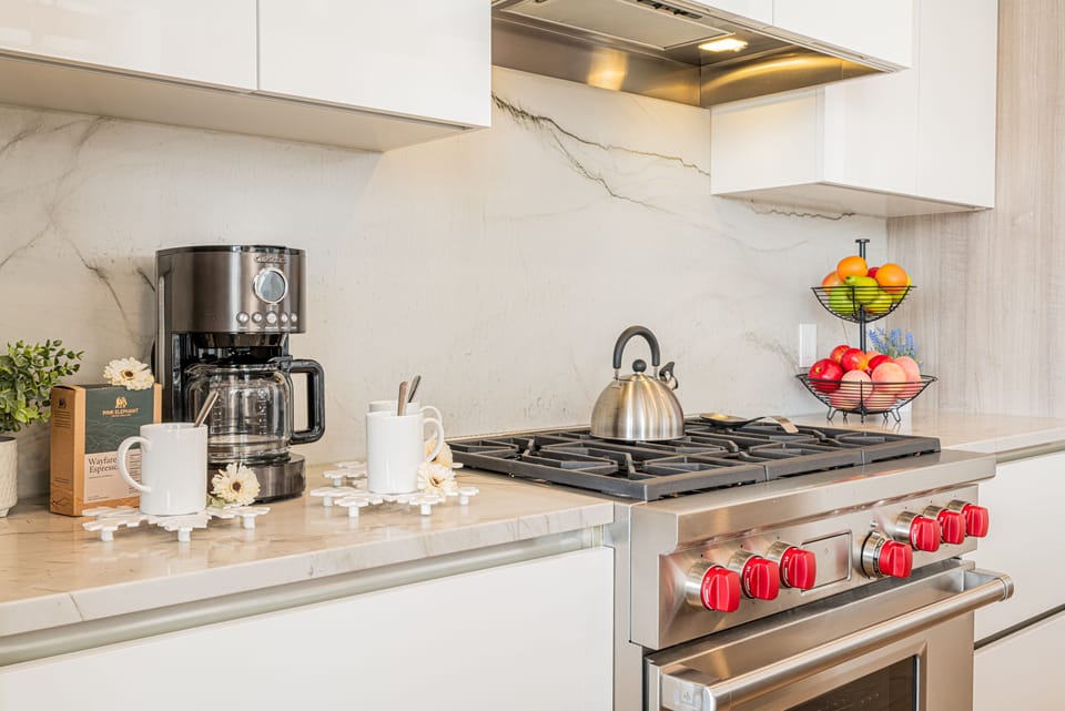 Fully Equipped Kitchen Offering Wolf Appliances and SubZero Refrigerator