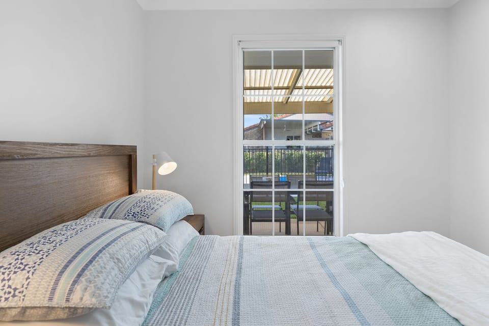 Bedroom 3: double bed with fan and built-in robes.
