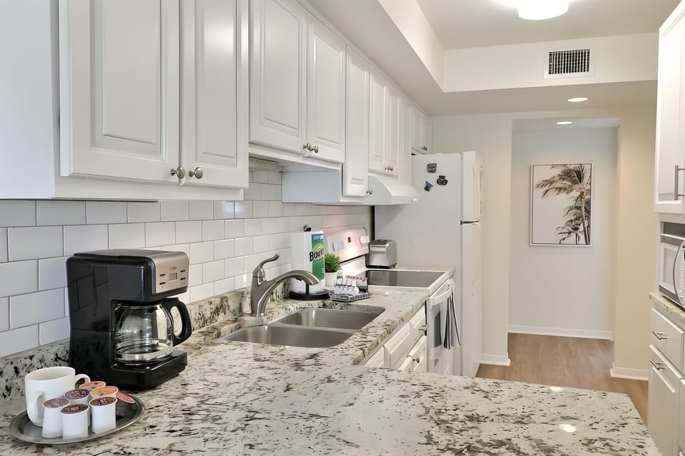 Beautiful kitchen featuring granite counter tops. 