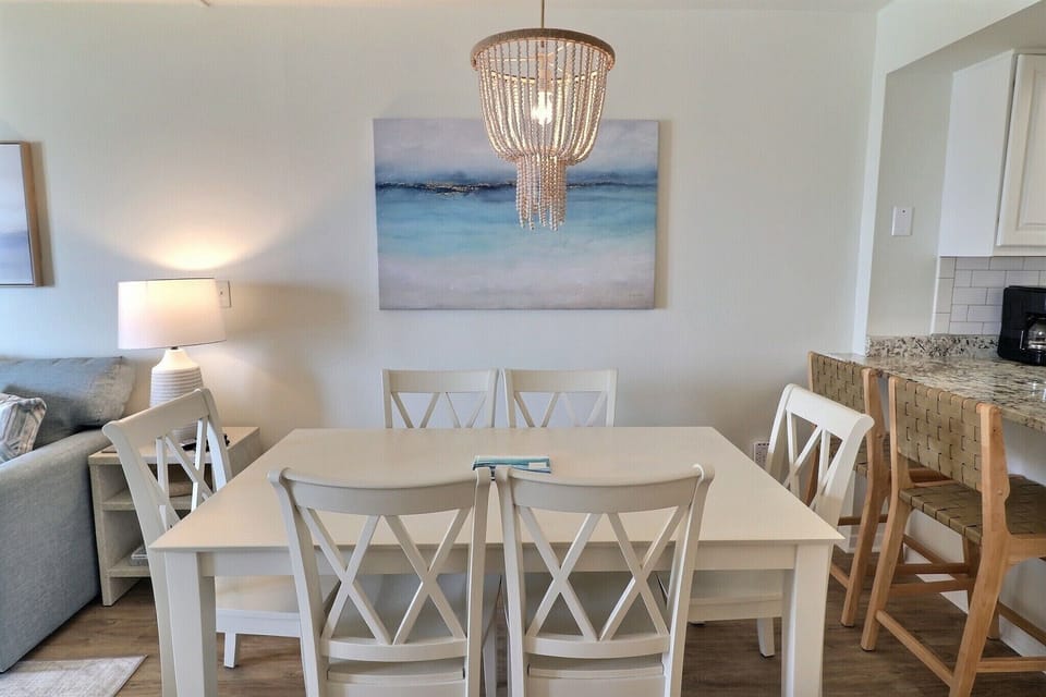 Six-person table accompanied by bar that seats two