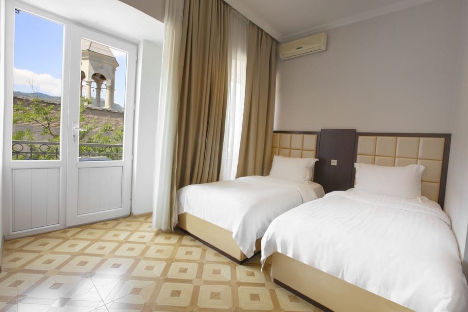 Standard Twin Room | In-room safe, desk, blackout drapes, iron/ironing board