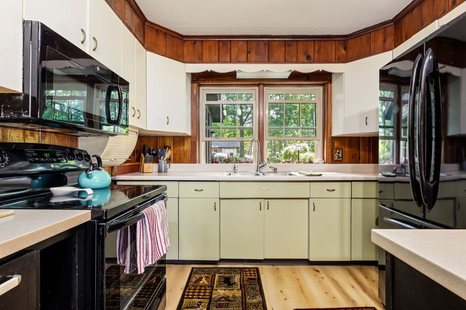 Full kitchen with stove, dishwasher, microwave & more