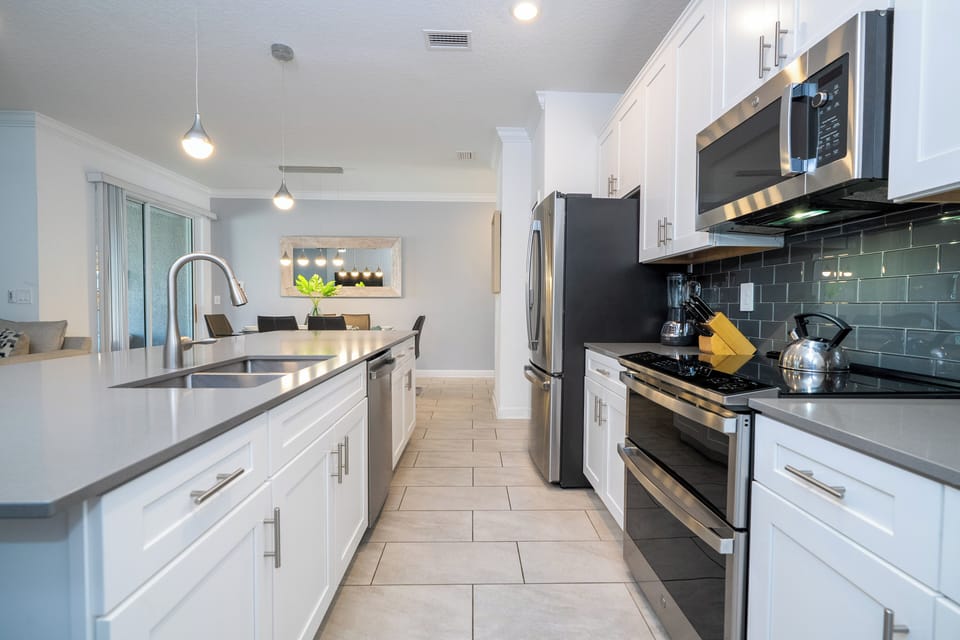 Fall in love for modern luxury with our stunning open kitchen—a beautiful, vibrant space that seamlessly combines style and functionality. a family-friendly retreat where the joy of cooking meets the warmth of togetherness.