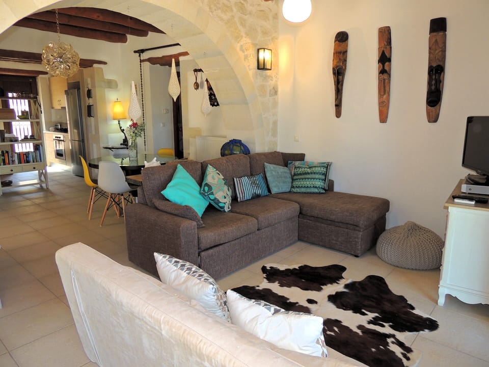 19 The Buoys living room with archway to dining and kitchen.