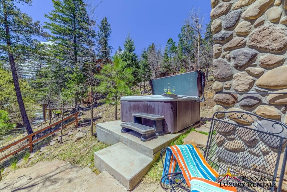 Relax in the outdoor tub with beautiful nature views.