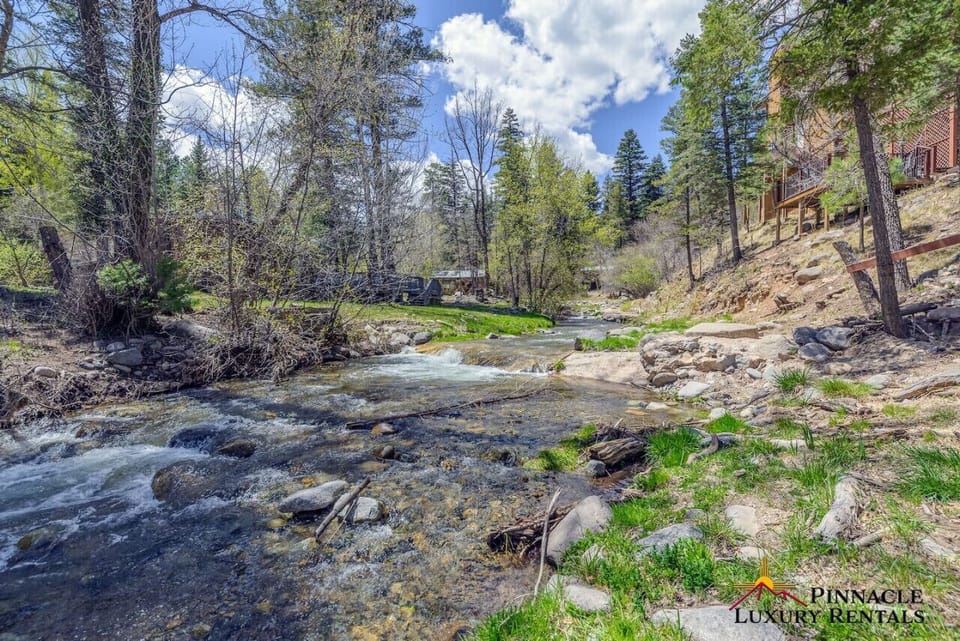 Relax with a peaceful stream view, surrounded by stunning nature."