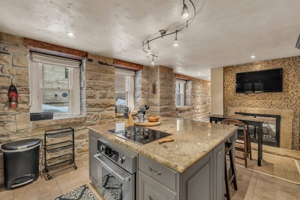 The view over the kitchen and the lovely exposed stone walls.