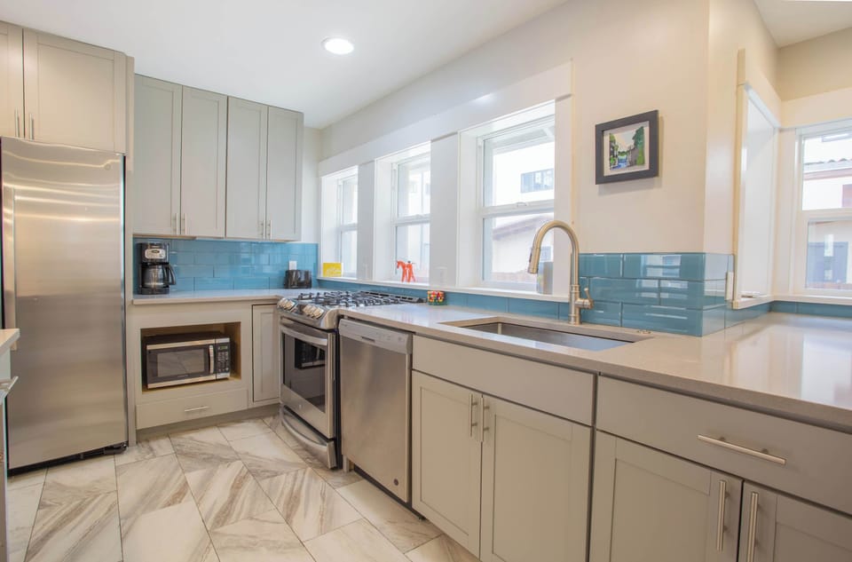 Fully stocked kitchen, upgraded appliances. 