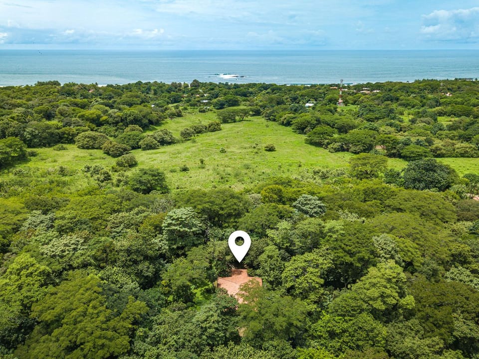 Bird's eye view of Casa de Paz and the beautiful beach of Playa Junquillal.