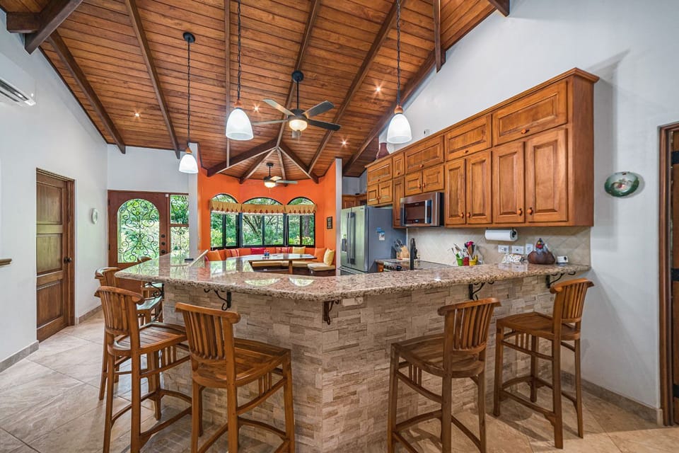 Fully equipped kitchen and bar counter.