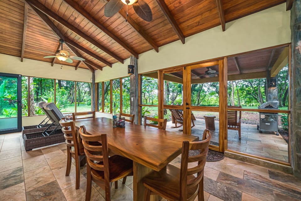 Screened-in patio's dining space.