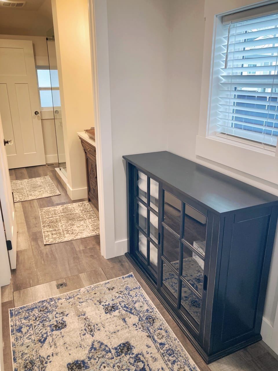 Extra linens and supplies at the ready. With second entrance to main bathroom. 