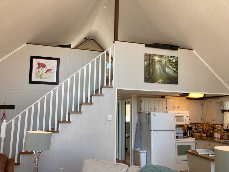 A tranquil escape awaits: The inviting upstairs loft and master bedroom.
