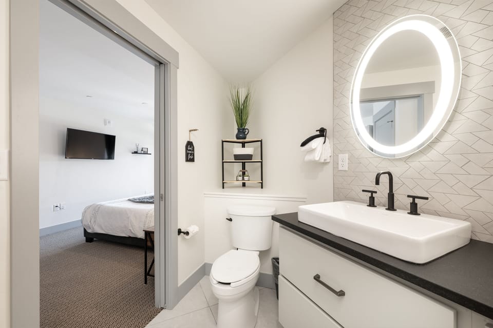 Another view of the modern bathroom right off the Primary bedroom