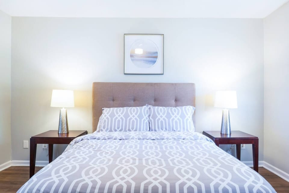 The master bedroom is spacious, with multiple outlets for charging devices.