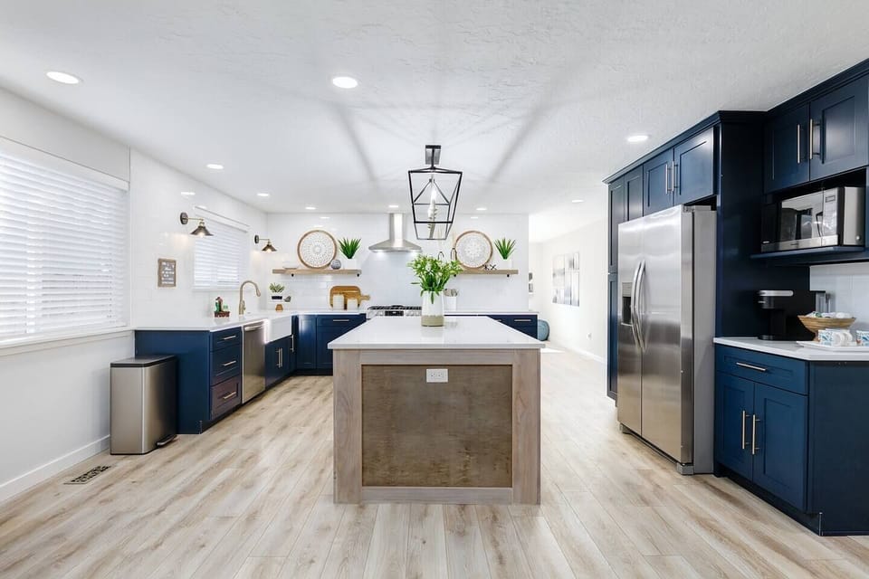 Updated, modern kitchen has plenty of lighting. 