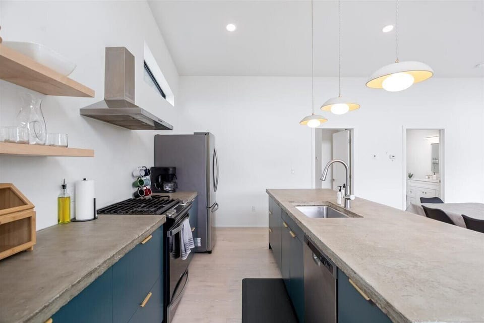 Modern clean lines and cement countertops.