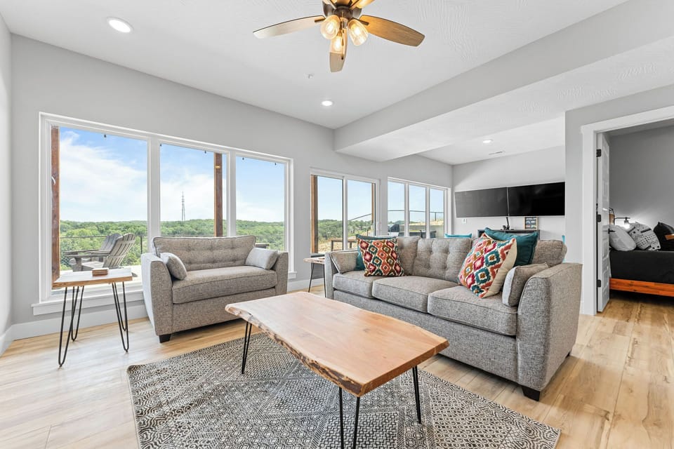Downstairs living area and arcade area combine for a great space for fun.