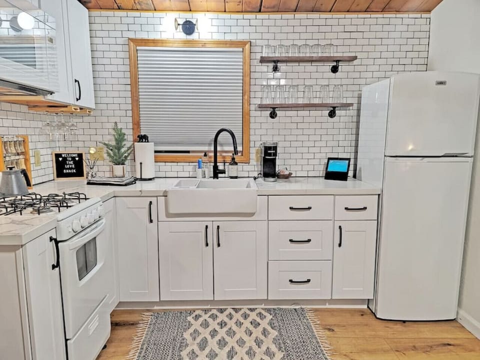 Our kitchen dreams have come true! Take a look at our updated space with all new cabinets and appliances – we're in love!