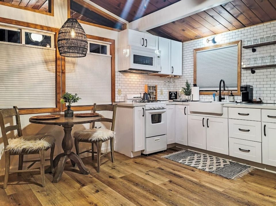 Ready to escape the hustle and bustle of everyday life? You won't want to miss this modern cabin! With its updated kitchen featuring newer cabinets and appliances, you will feel refreshed and relaxed in no time.
