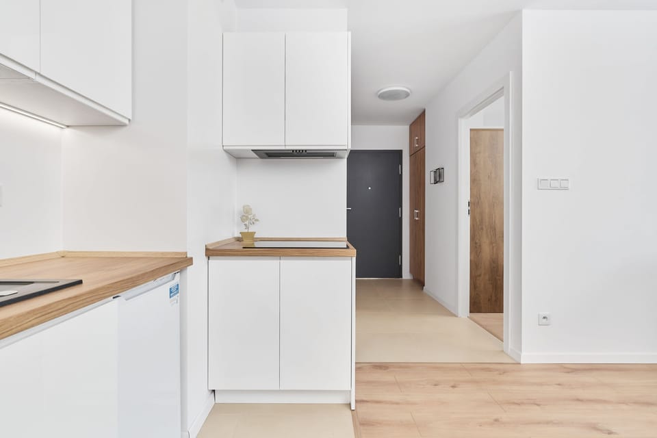 A modern kitchen with white cabinets, clean lines, and a bright and airy feel. 