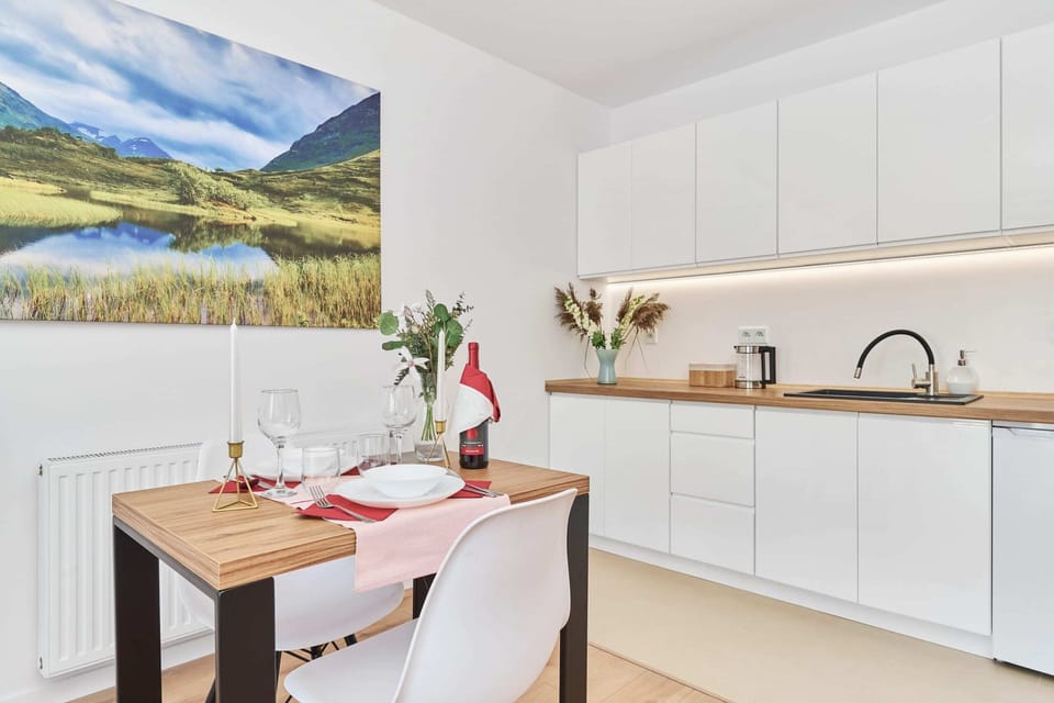 A modern kitchen with white cabinets, clean lines, and a bright and airy feel. 