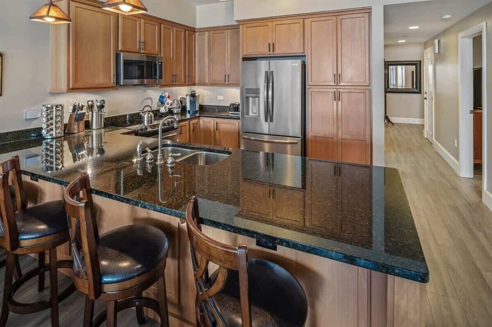 The kitchen is fully appointed with additional counter seating.